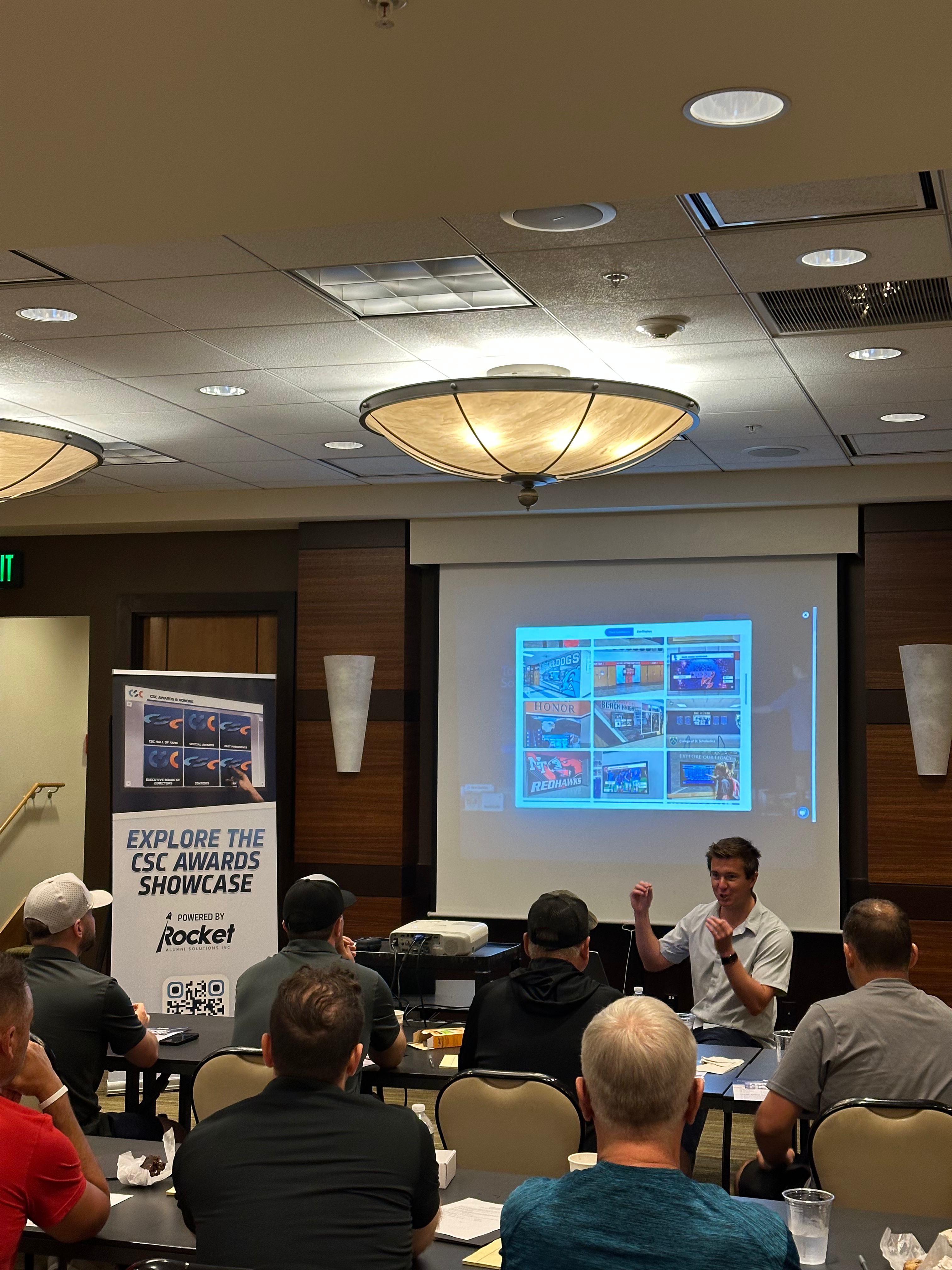 Chase from Rocket Alumni Solutions presenting at the 2025 Gold Athletics Meeting.