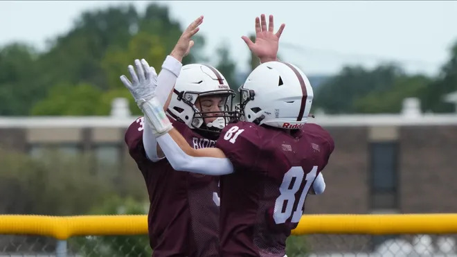 Ridgewood Football players celebrating a play.