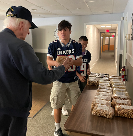 The Apponequet High School football team sold gourmet popcorn to one purchaser, who bought 30 bags and requested that they be donated to local veterans. 