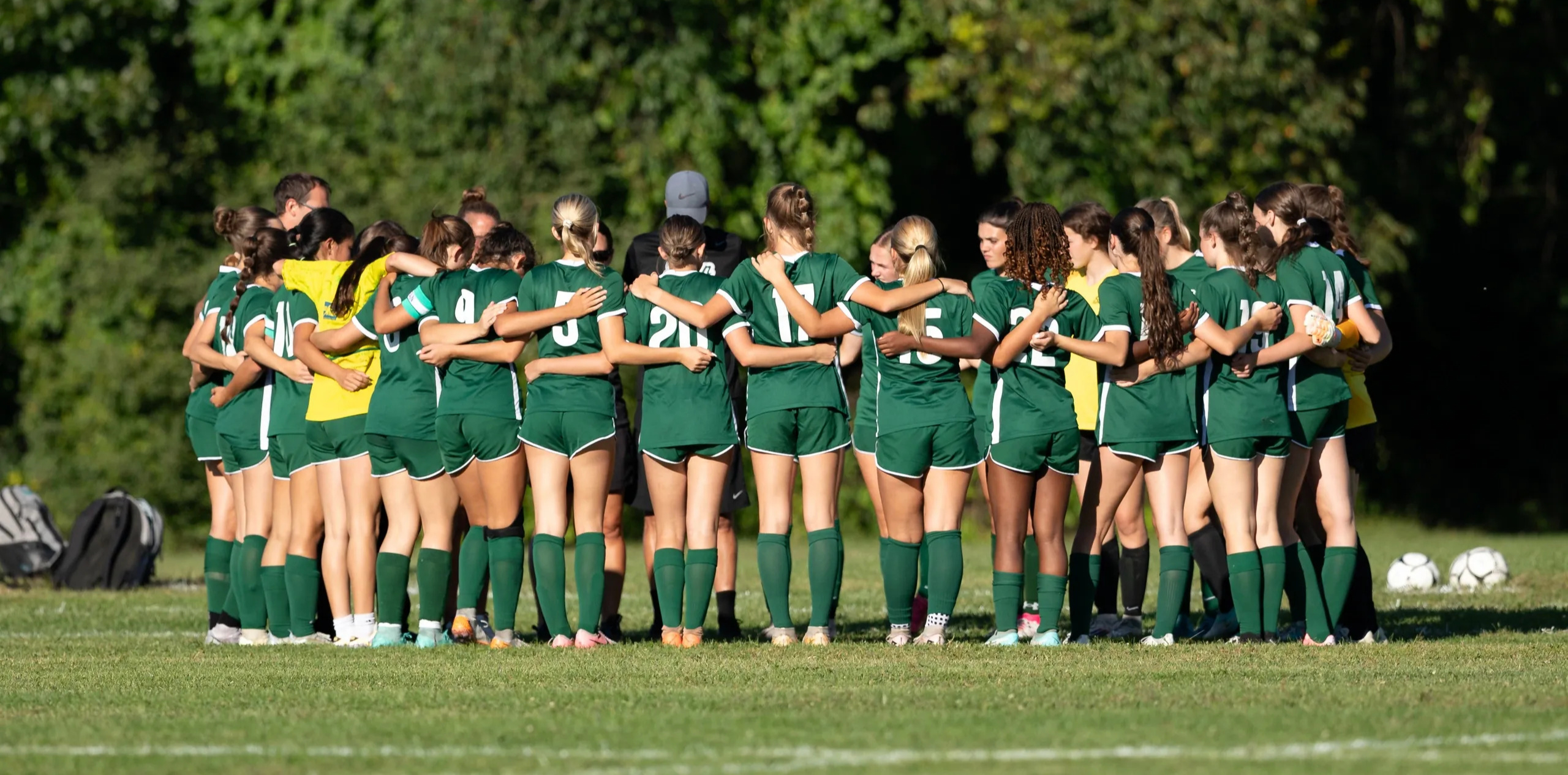 The Shen Girls Soccer team huddled during a game