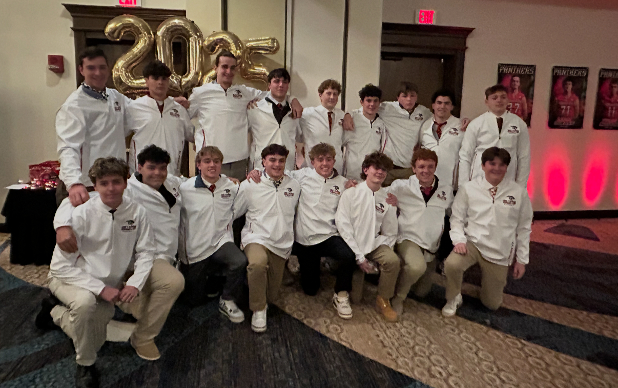 Holliston Football in the prizes/gear they earned through their Gold Athletics fundraiser.