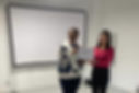 Care worker Maria C. holding a certificate of training completion with Tresacare founder Elizabeth Beh