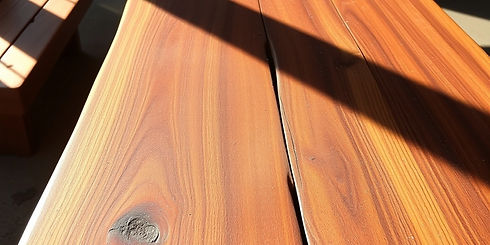 wide walnut bench with rich, warm colors and sunlight casting over the surface in a slight...air.jpg