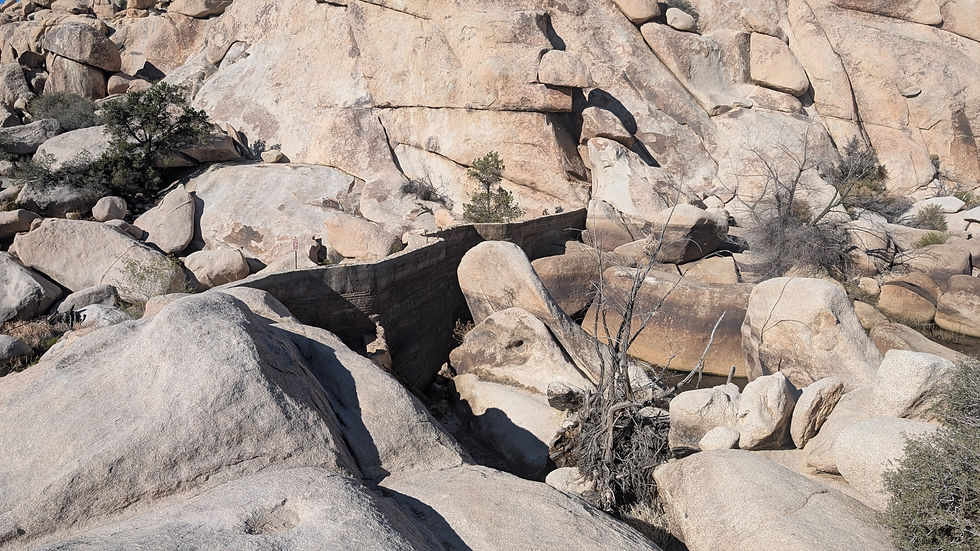 Barker Dam in Joshua Tree National Park, California partially filled with water