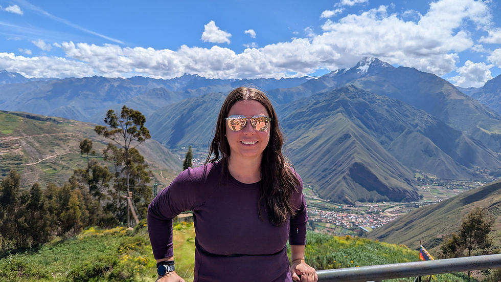A women standing at an overlook of the Sacred Valley in Peru