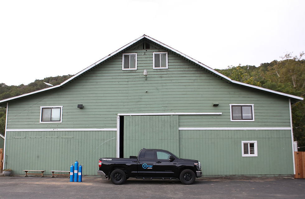 ANG truck in front of green barn