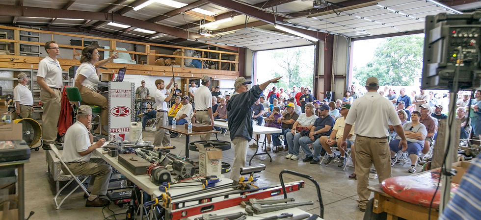 Eye-level view of auctioneer standing at podium in a Murfreesboro auction house