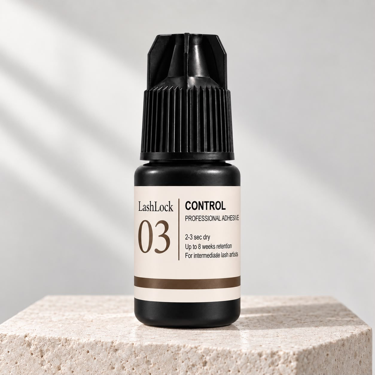 LashLock 03 Control eyelash extension glue with 2–3 second drying time for intermediate lash artists.