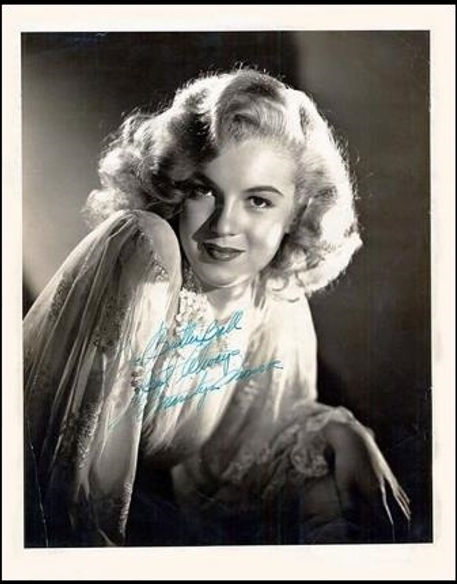 Publicity photo Marilyn Monroe signed at Carlyle's in Salinas as a promotion for Stanley Seedman's jewelry store in Salinas, California. It's a still from Ladies of the Chorus, 1948.