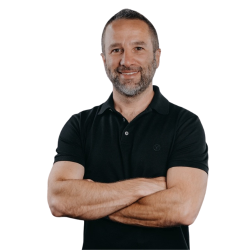 Portrait of a smiling leader with crossed arms.