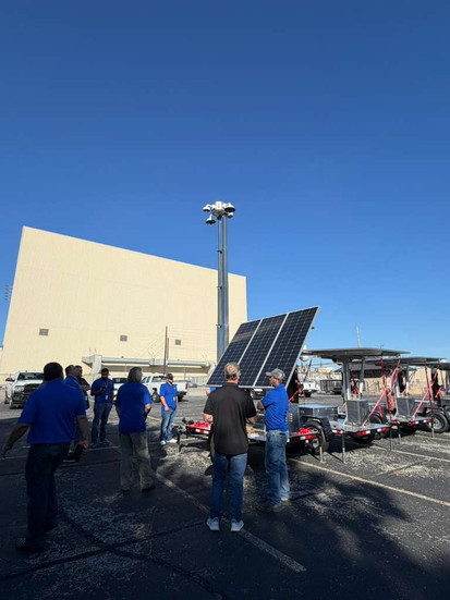 People gathered around a Sun Surveillance Solstice Trailer