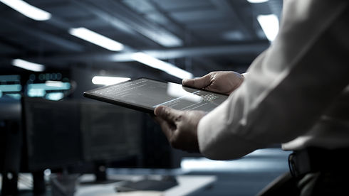 close-up-tablet-used-by-it-worker-doing-maintenance-server-farm-gear_edited.jpg