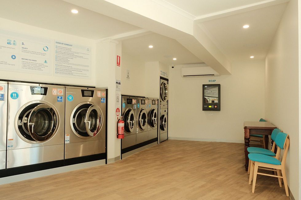 Interior of Bubble Goose Laundry near Glen Osmond showing rows of washing machines and dryers