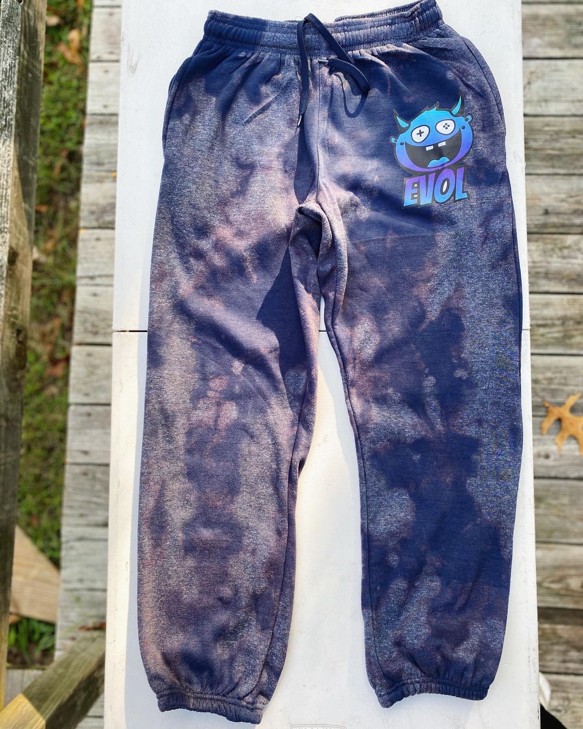 Bleached navy blue sweats with blue and purple evol logo