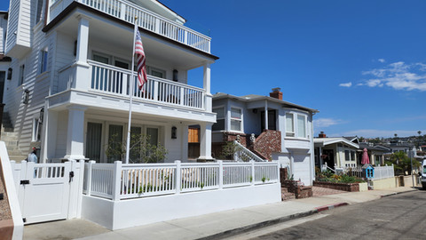 White vinyl T-top picket fence installed  by Torrance Fence Company