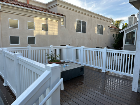 White vinyl T-Top picket fence installed on  deck by Torrance Fence Company