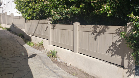 Smooth driftwood privacy vertical vinyl fence. Installed by Torrance Fence Company