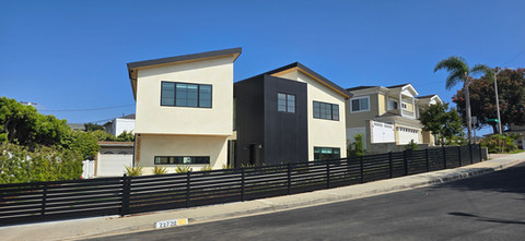 Panoramic view of a black aluminum semi-privacy fence . Installed by Torrance Fence Company
