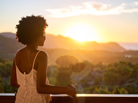 Woman watching a sunset after the passing of her dog