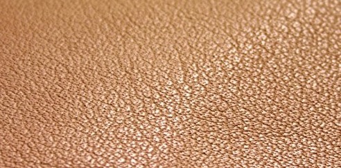 Uncoated leather showing natural grain and markings