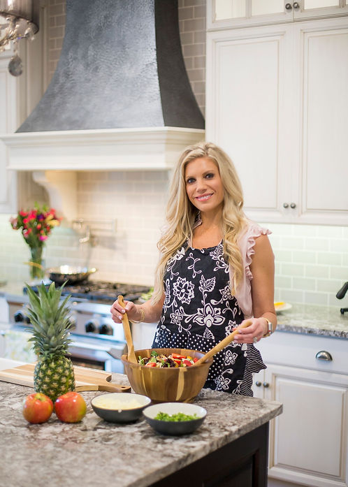 A picture of Caitlin in her kitchen