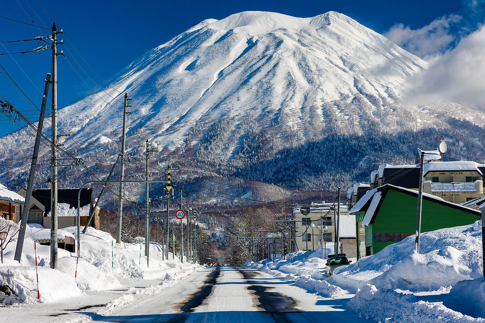 Towering startovolcano Mount Yotei rising above the Japanese ski resort town of Niseko, Ho