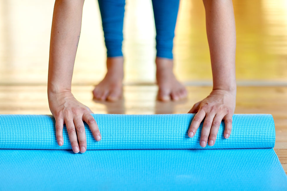 woman-hands-rolling-yoga-mat-at-gym-or-studio-2021-08-26-22-50-08-utc.jpg