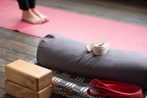 caucasian-females-legs-on-yoga-mat-with-yoga-props-2021-08-29-08-39-06-utc.jpg