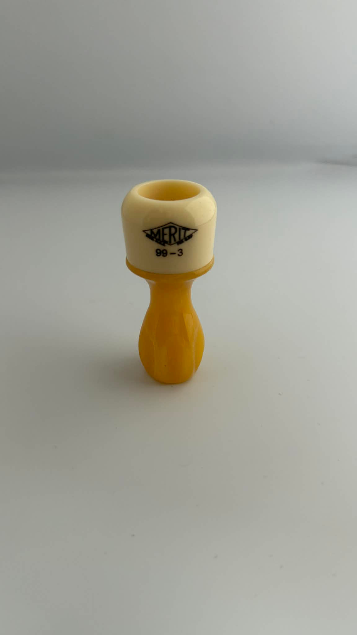 21 MM MERIT 99-3 BUTTERSCOTCH SWIRL & CREAM WITH BLACK LETTERS