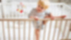 Toddler climbing out of cot