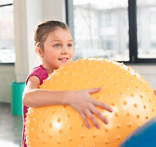 cute-smiling-little-girl-holding-fitness-ball-and-2024-11-07-16-01-58-utc.jpg