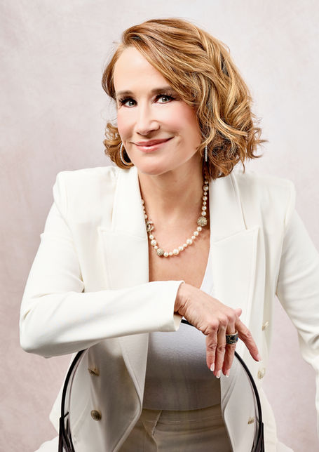 Professional editorial branding portrait of a woman in white blazer, natural light studio photography by Peggy Cormary Washington DC portrait photographer