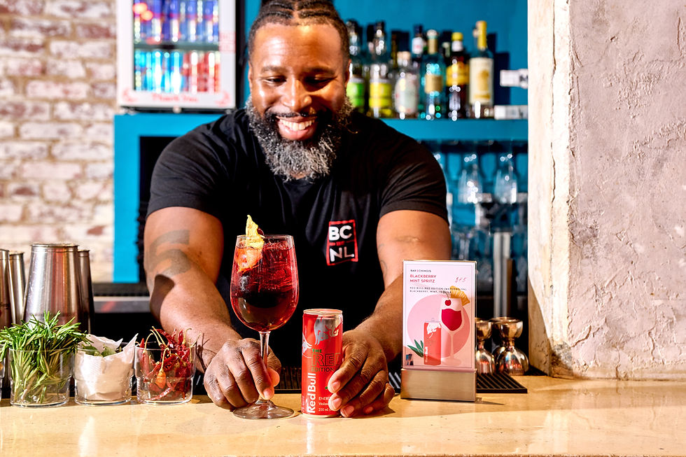 Eye-level view of a food photographer adjusting lighting equipment in a studio