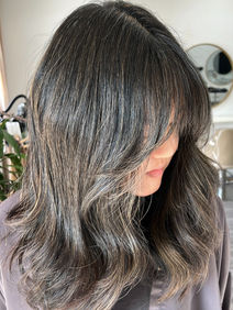 Gray blending color technique for a seamless transition from natural gray hair on dark hair to ends.
