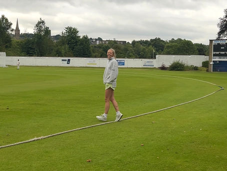 Cricket Widow on the boundary at a Cricket Match