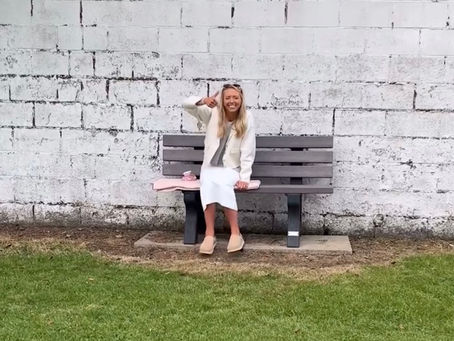 A cricket widow sat on the boundary