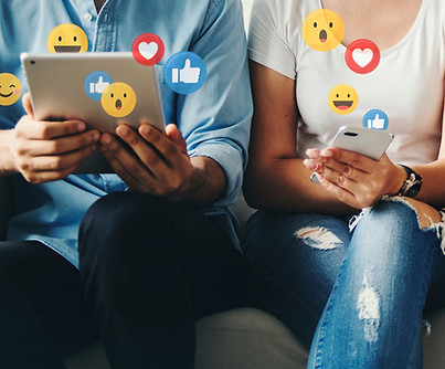 A couple sharing social content digitally between devices