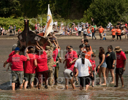 Canoes arriving at host Nation and being carried to resting area for canoes.jpg