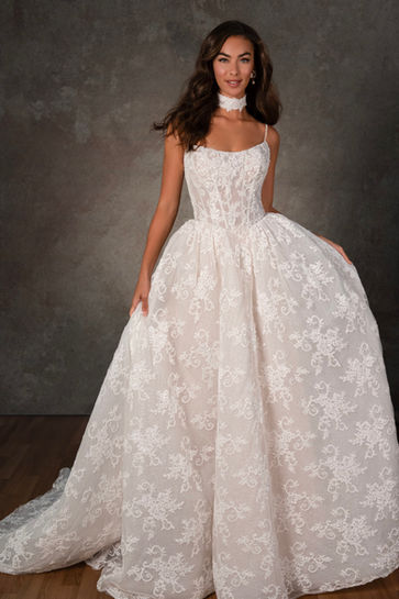 Designer luxury lace wedding dress with basque waist in San Antonio bridal boutique.