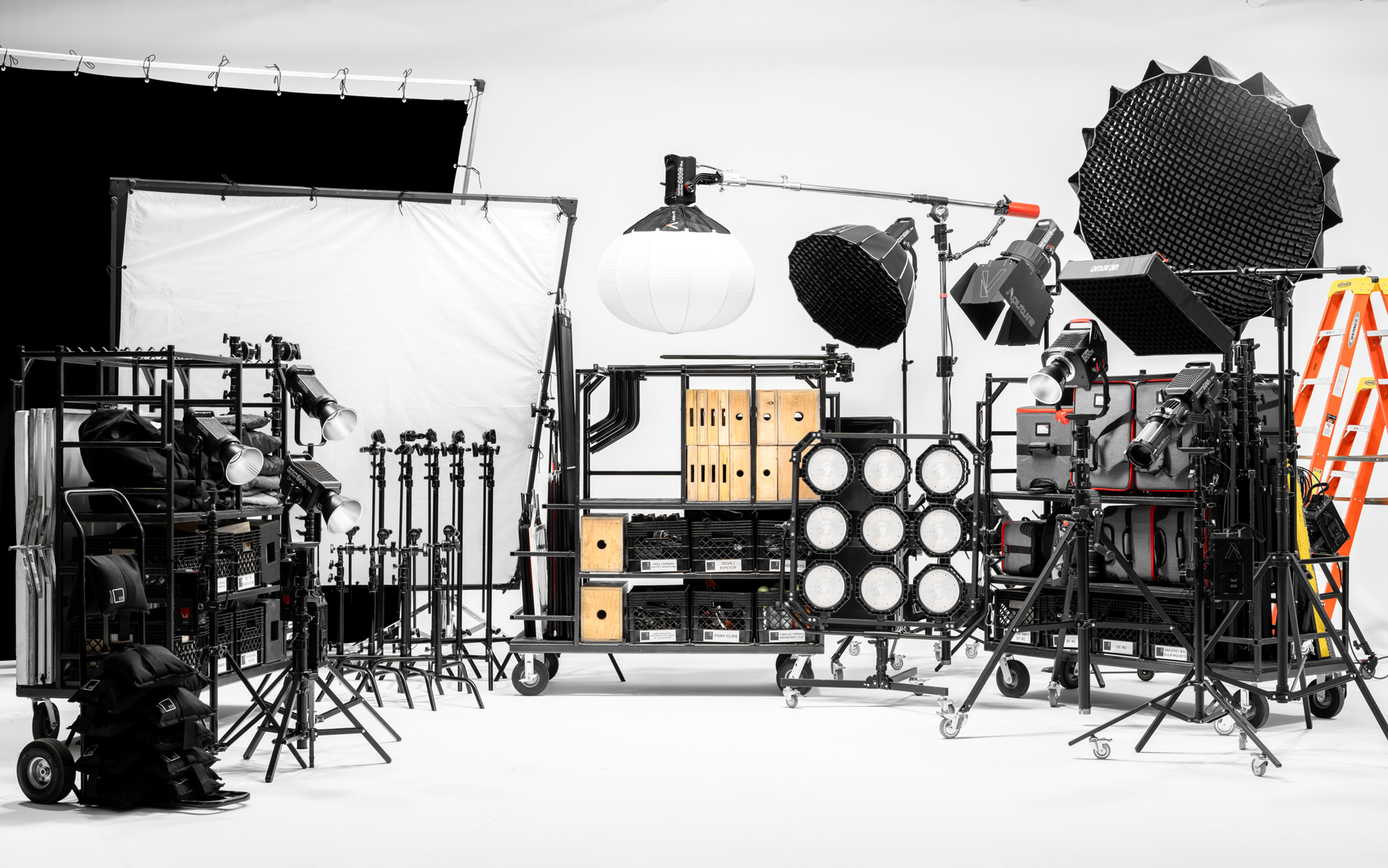Comprehensive studio package including lighting fixtures, grip tools, stands, and production support gear.