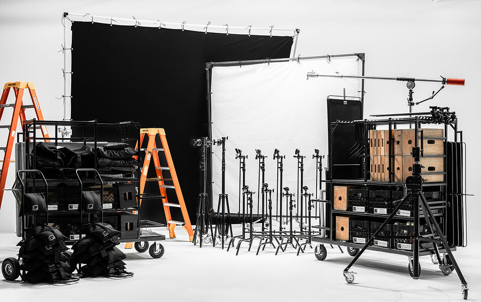 Film grip equipment package with C-stands, clamps, rigging gear, and support hardware for production