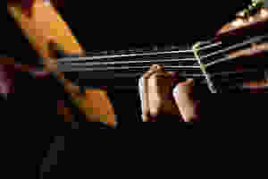A man playing classical guitar