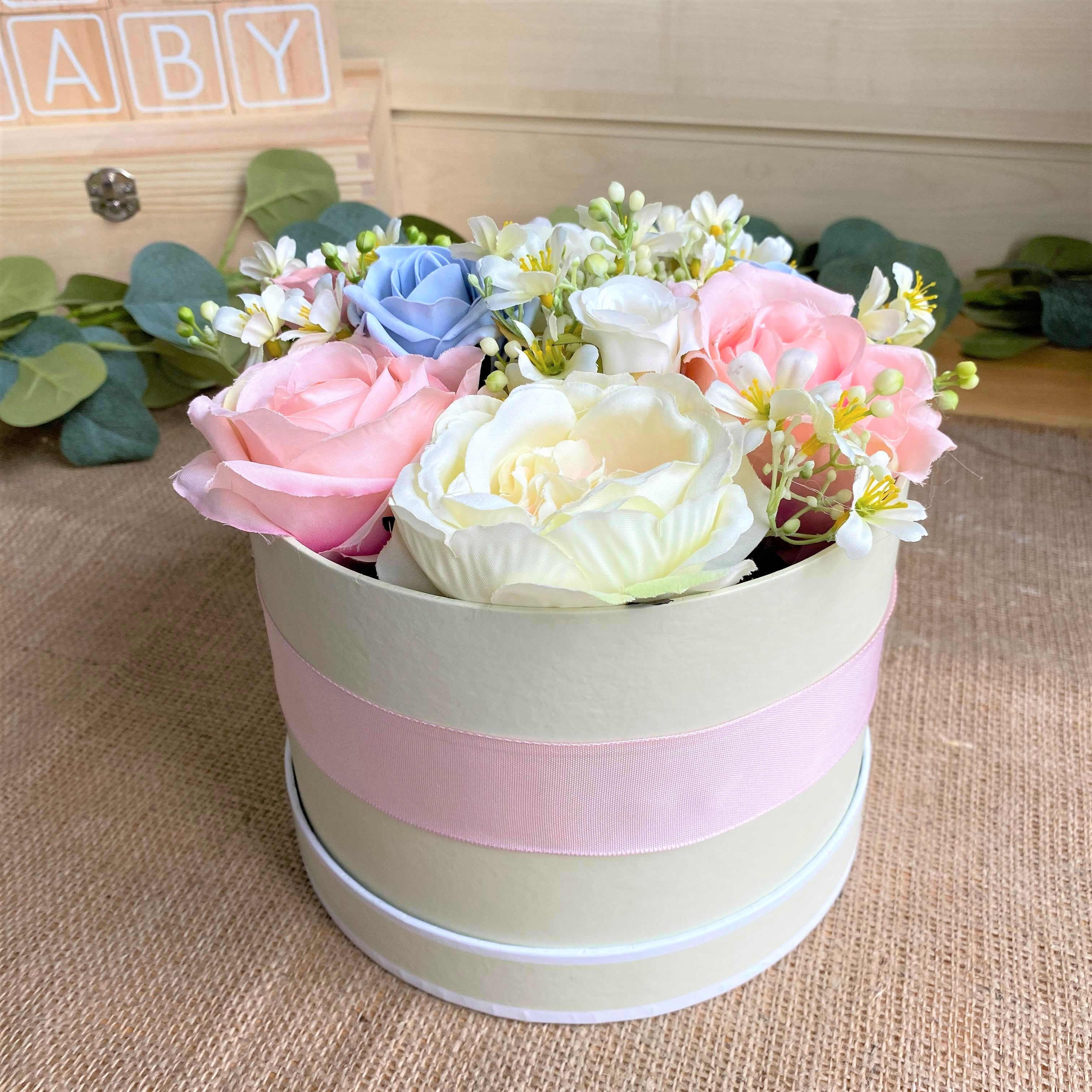 Bright spring flowers in hatbox