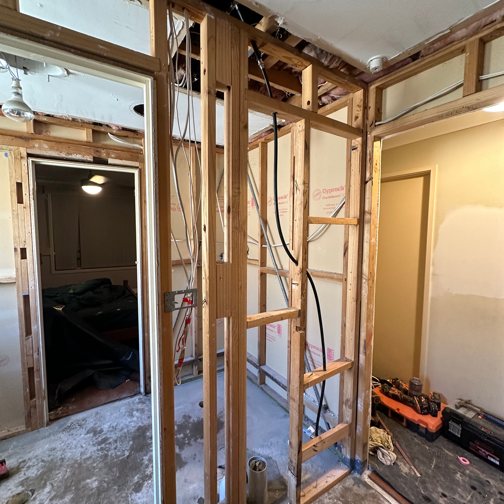 a room being remodeled with a box that says panasonic on it