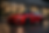 Roter Sportwagen im Abenddämmerunglicht.png