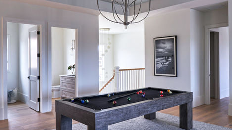 Modern pool table in a spacious landing area.