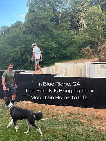 A photo of the home's foundation under construction in Blue Ridge, GA. A man, a teenager, and a dog are on the site, which features concrete foundation walls against a wooded backdrop. Text overlay reads: "In Blue Ridge, GA This Family Is Bringing Their Mountain Home to Life. James Knight architect Reynard Custom Homes