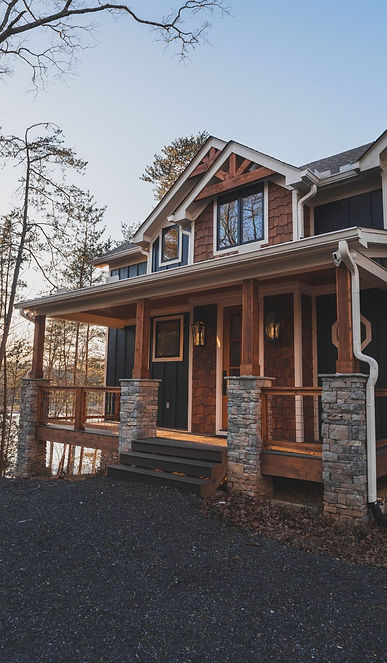 Exterior photo of a custom home on Nottely Lake in Blairsville, GA the vacation lake home was designed by James Knight architect at Reynard Custom Homes and photos are by Kalyn Kight