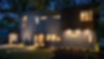 Exterior twilight view of a modern two-story home with geometric gray panels and dark wood siding, i