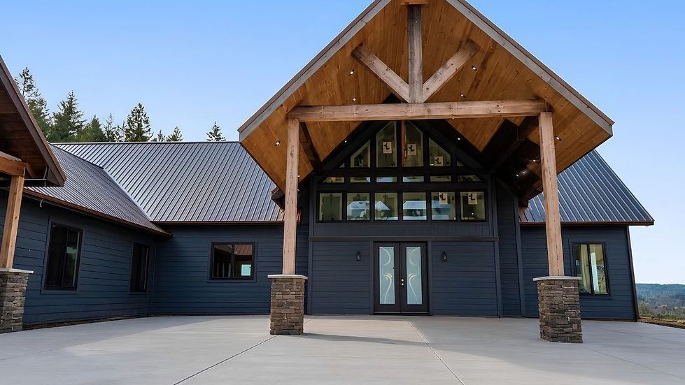 Exterior of the modern rustic cabin with its complete stone base, stairs, and natural wood